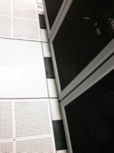 Floor guard cable seal mounted underneath server racks in the data center